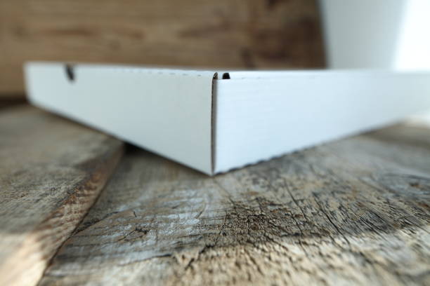 istock White cardboard box for pizza on a wooden table. 1132424721