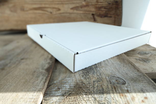 istock White cardboard box for pizza on a wooden table. 1132424722