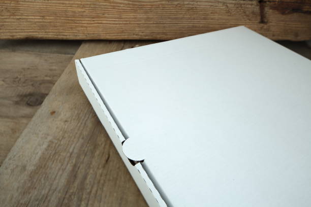 istock White cardboard box for pizza on a wooden table. 1132424734