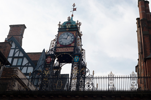 Chester, England - February 23, 2019: view of the iconic clock tower of Chester, also known as the Eastgate and Eastgate clock.