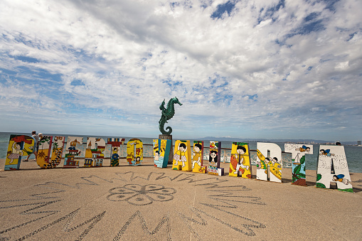 Puerto Vallarta, Mexico - February 2019: Life-sized letters spell out Puerto Vallarta and people always stop by for a selfie.