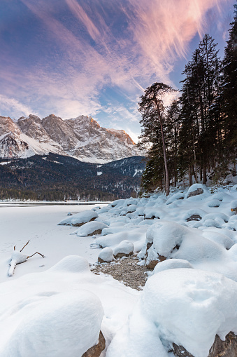 Frozen lake Eibsee below Zugspitze mountain in winter, Bavaria, Germany