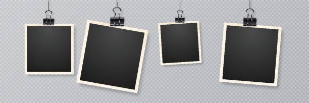 Retro realistic frame placed on transparent background. Picture frames with shadow hanging with paper clip Retro realistic frame placed on transparent background. Realistic vector photo frame with straight edges on sticky tape placed vertically. Picture frames with shadow hanging with paper clip sticky photos stock illustrations