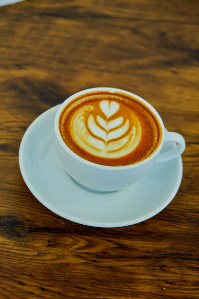istock High View Of Cappuccino On Wooden Table 1132428197