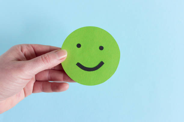 istock Crop hand with positive green smiley 1132428223