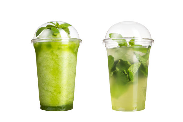 istock Delicious fruit smoothies in plastic cups, on a white background. Two cocktails with a taste of kiwi and mojito. 1132429567