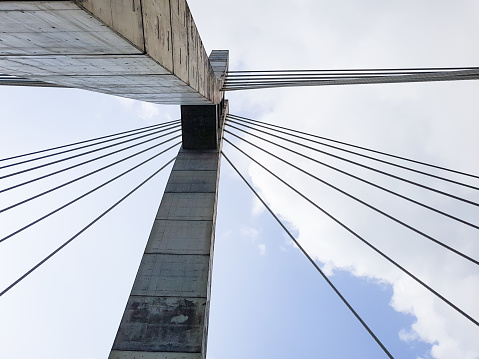 The main concrete mast of the Lekki-Ikoyi bridge in Lagos, Nigeria, as seen from below. Bridge tower with cable stays.