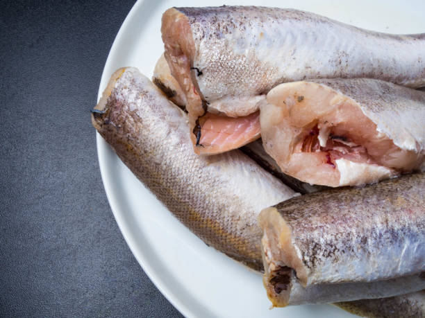 istock Frozen fish hake isolated on white plate 1132430781