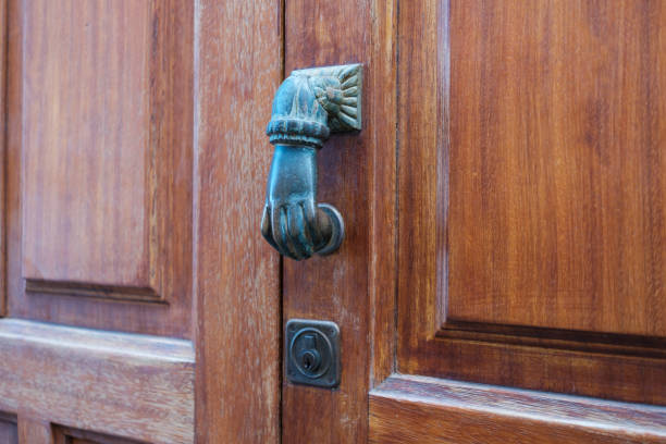 istock door knob, hand shape knocking door knob  - 1132431462