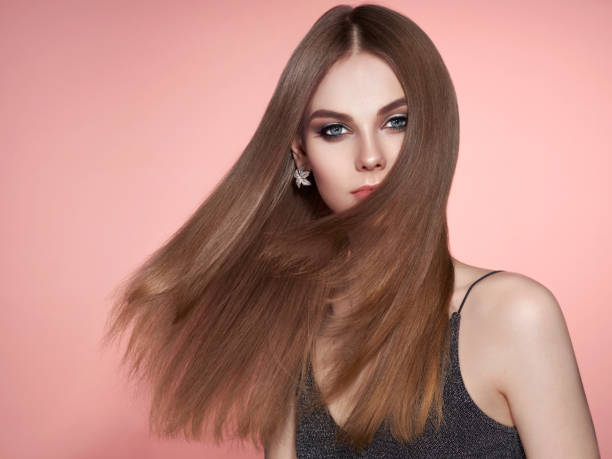 istock Brown-haired woman with long smooth hair 1132433946