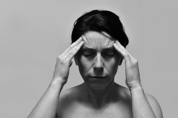 istock middle-aged woman with headache 1132438146