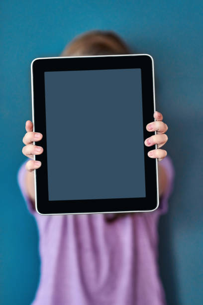 boy playing tablet. white background