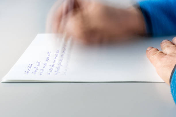 istock Man writes letter to his partner 1132438814