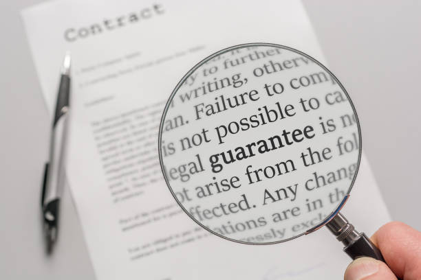 guarantee conditions of a contract are checked carefully with a magnifying glass - condition text magnifying glass contract imagens e fotografias de stock