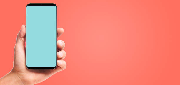 istock hand holding bezel-less smartphone 1132438959