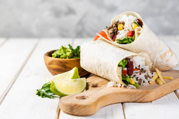 istock Mexican food - burrito and ingredients 1132442540