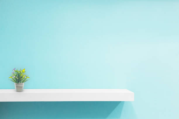 istock Empty white shop shelf, retail shelf on blue vintage background. 1132442561