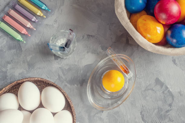 istock Chicken white eggs are ready for painting with colorful paints for Easter. Close-up. 1132442672