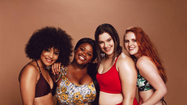 istock Group of happy different size women in bikinis 1132444843