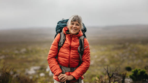 istock Female hiker standing on a hill 1132445035