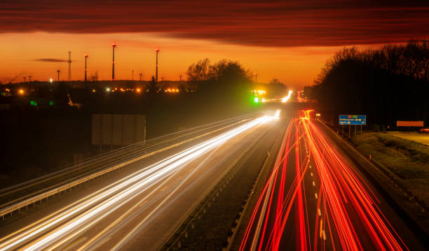 istock the light trails on motorway highway during a dramatic sunset 1132446376