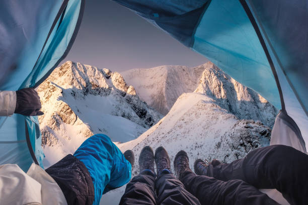 istock Group of climber are inside a tent with open for view of blizzard on mountain 1132448257
