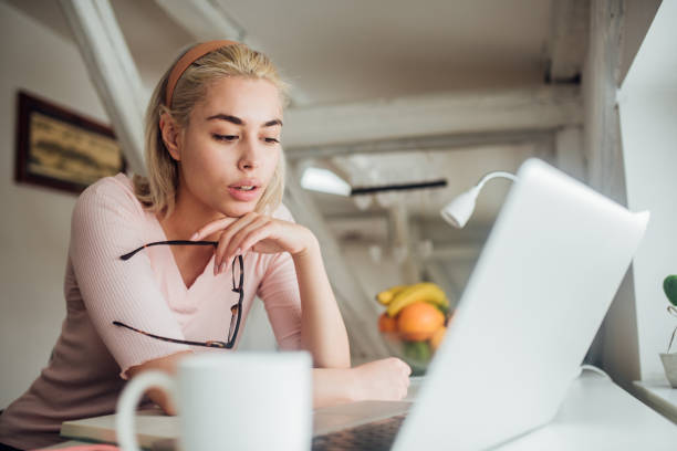 istock Girl looking at laptop 1132449573
