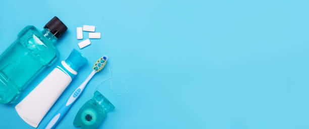 istock Tools for dental care: orthodontic brush, floss, toothpaste. Invisible dental aligners modern tooth brackets transparent braces to straighten teeth in cosmetic dentistry and orthodontics 1132450912