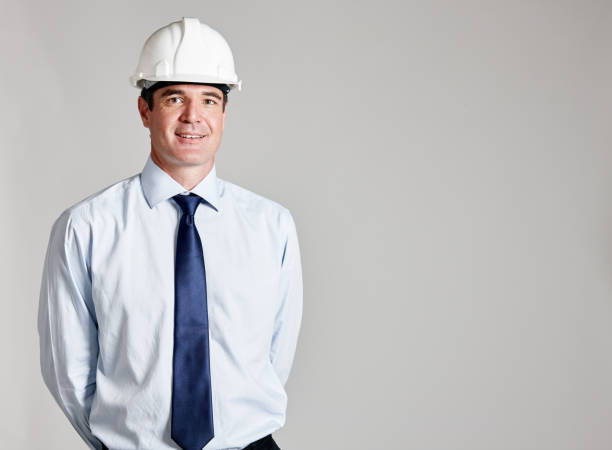istock Smiling man, possibly engineer,  in hard hat, shirt and tie 1132450970