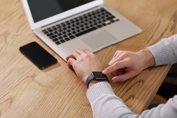 istock Men's hand touching watch on top view. Can be used as mock up 1132451059