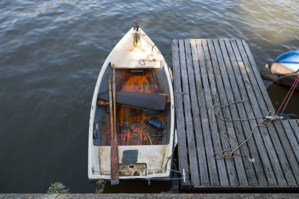 istock Small wooden rowboat at the jetty 1132451480