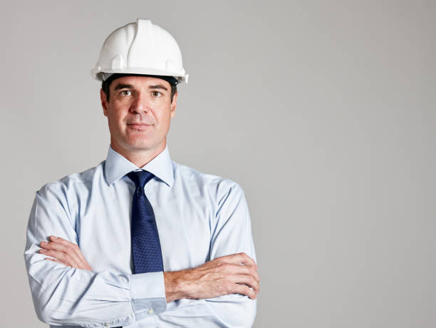 istock Confident-looking construction professional in hard hat with arms crossed 1132451656