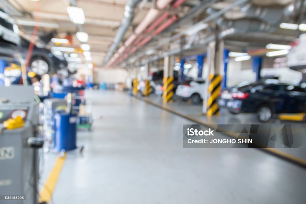 Auto repair service center blurred Auto Repair Shop, Garage, Workshop, Working, Car Auto Repair Shop Stock Photo