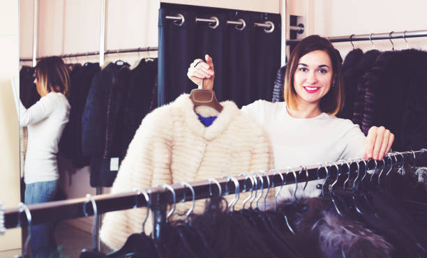 istock Girl choosing mink jacket 1132455795