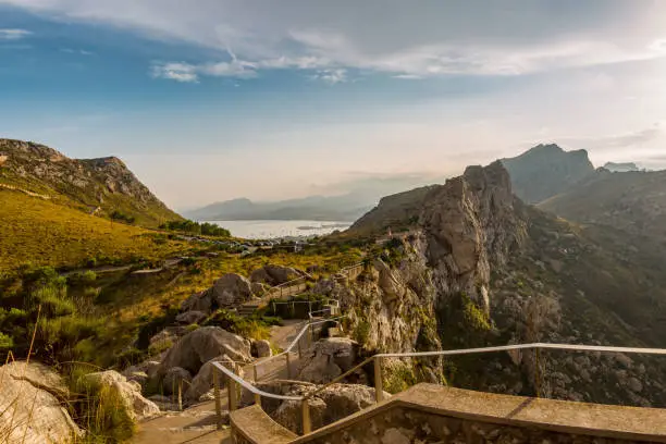 Footpath in the mountains of Mallorca with a view to the town Alcudia