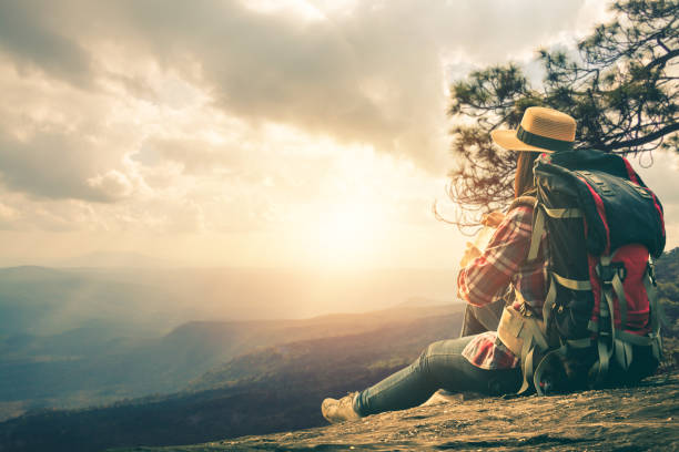 istock Side View Of Backpacker Looking At Mountains Against Sky During Sunset 1132457243
