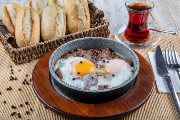 istock Turkish scrambled eggs with Kavurma. Roasting on wooden table. 1132459227
