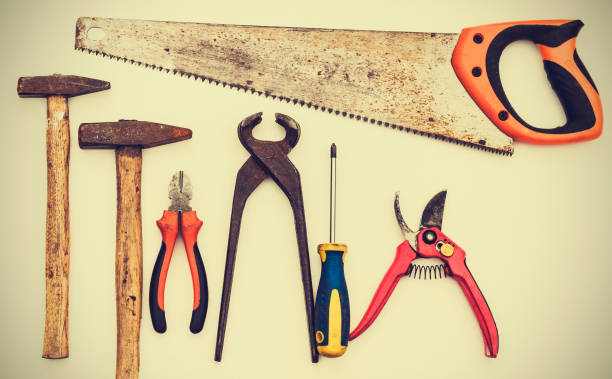 istock Set of vintage hand construction tools on a white wooden background, retro concept . 1132462024