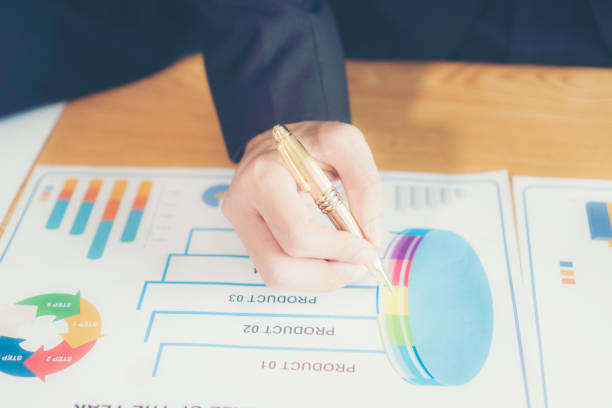 istock Close-Up Of Businessman Working Over Graph On Table 1132462080