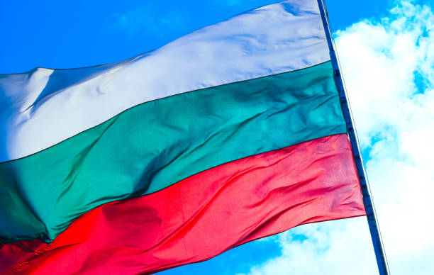 istock Tree-colored white, green and red Bulgarian flag waving on the blue sky background. 1132462675