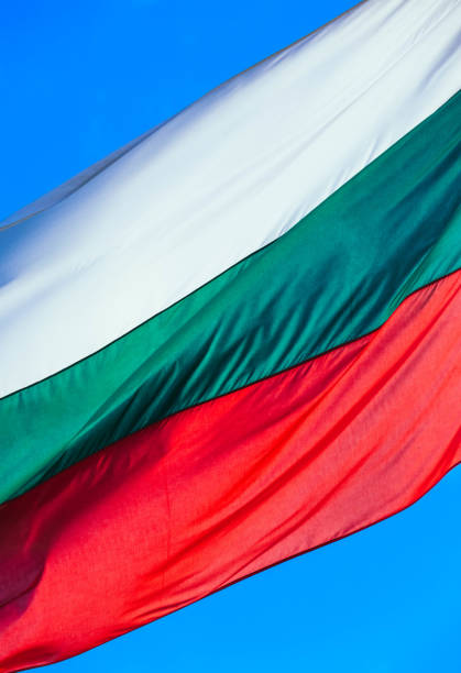 istock Tree-colored white, green and red Bulgarian flag waving on the blue sky background. 1132462681