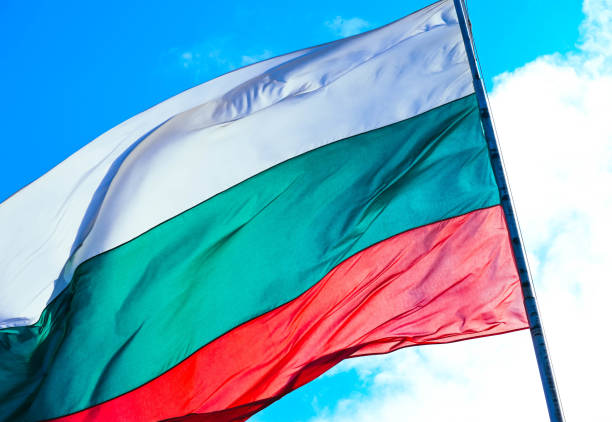 istock Tree-colored white, green and red Bulgarian flag waving on the blue sky background. 1132462702