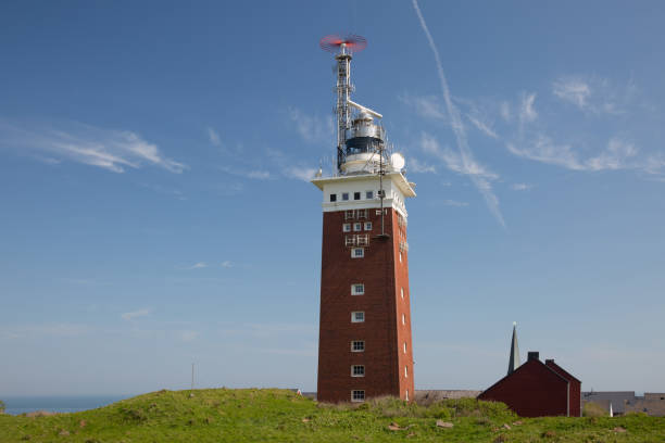 Lighthouse of Island Helgoland in the sun Lighthouse on a hill of the offshore island Helgoland helgoland stock pictures, royalty-free photos & images