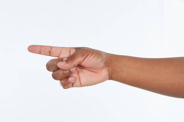 istock Man's hand raised with finger pointing sideways to left 1132466571