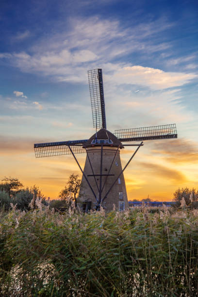 istock The sunset view of traditional Dutch windmill in Kinderdijk, Netherlands 1132467862