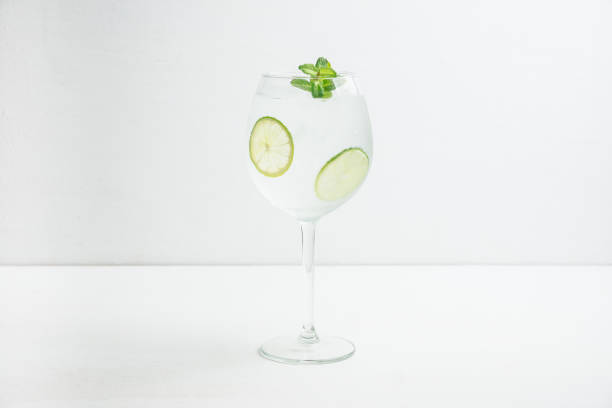 istock Martini royale cocktail in wine glass with lime and mint 1132468297