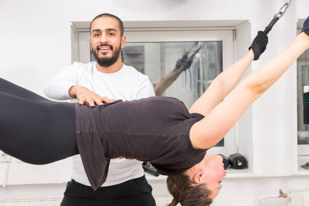 istock Fitness instructor smiling during workout at gym 1132473736