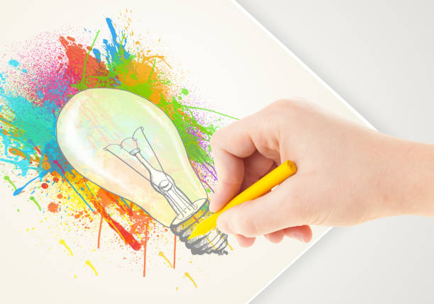 istock Hand drawing on paper a colorful splatter lightbulb 1132474540