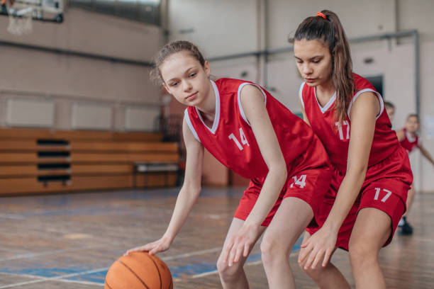 istock Young girls playing basketball on training 1132475558