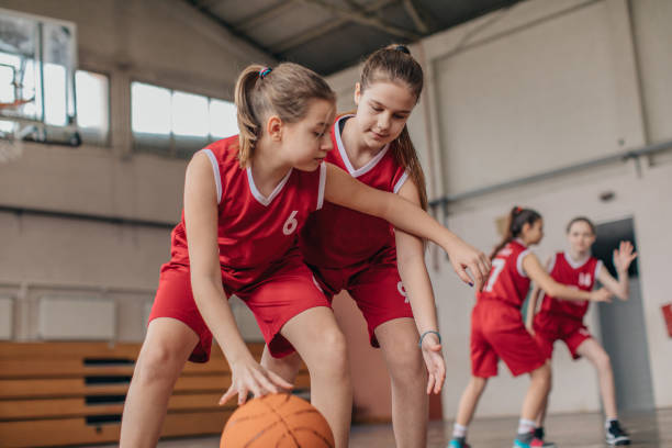 istock Girls playing basketball 1132475583